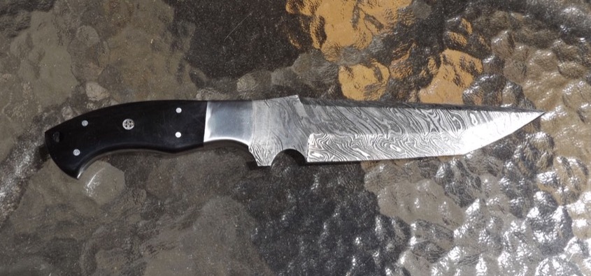 A nice fixed-blade fighting knife, made in Pakistan out of Damascus steel